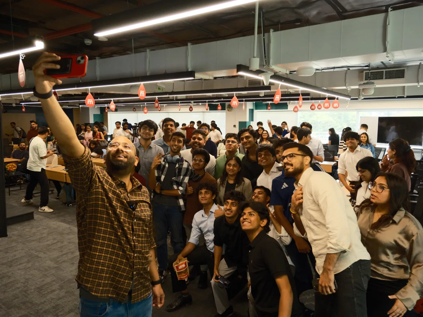 A Mesa cohort taking a group selfie on campus