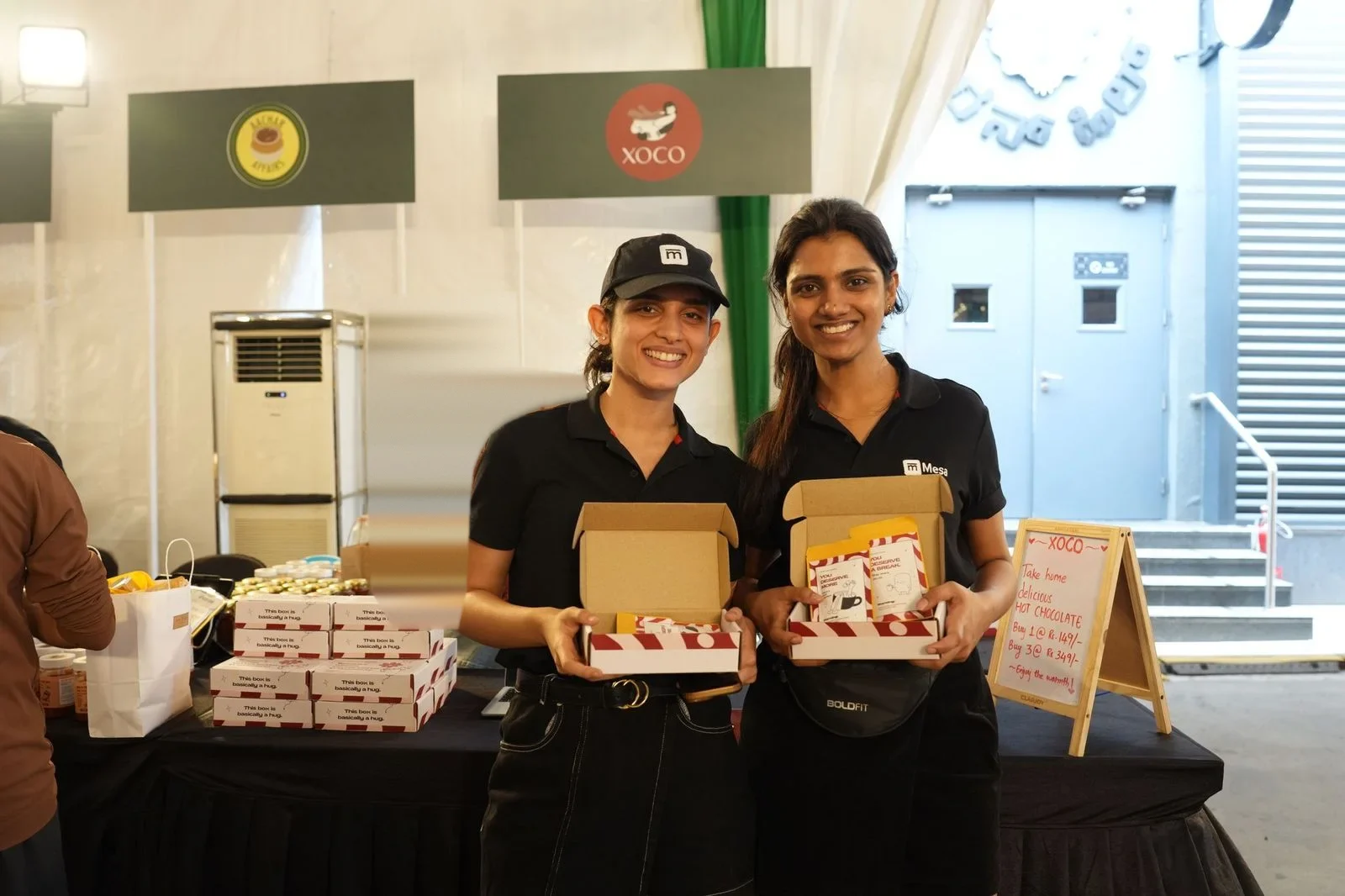 XOCO founders at their stall