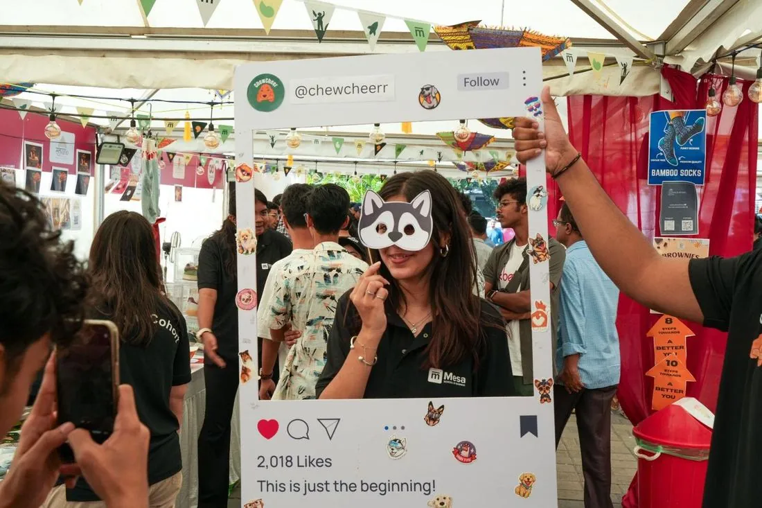 A customer at a BYOB brand photo booth