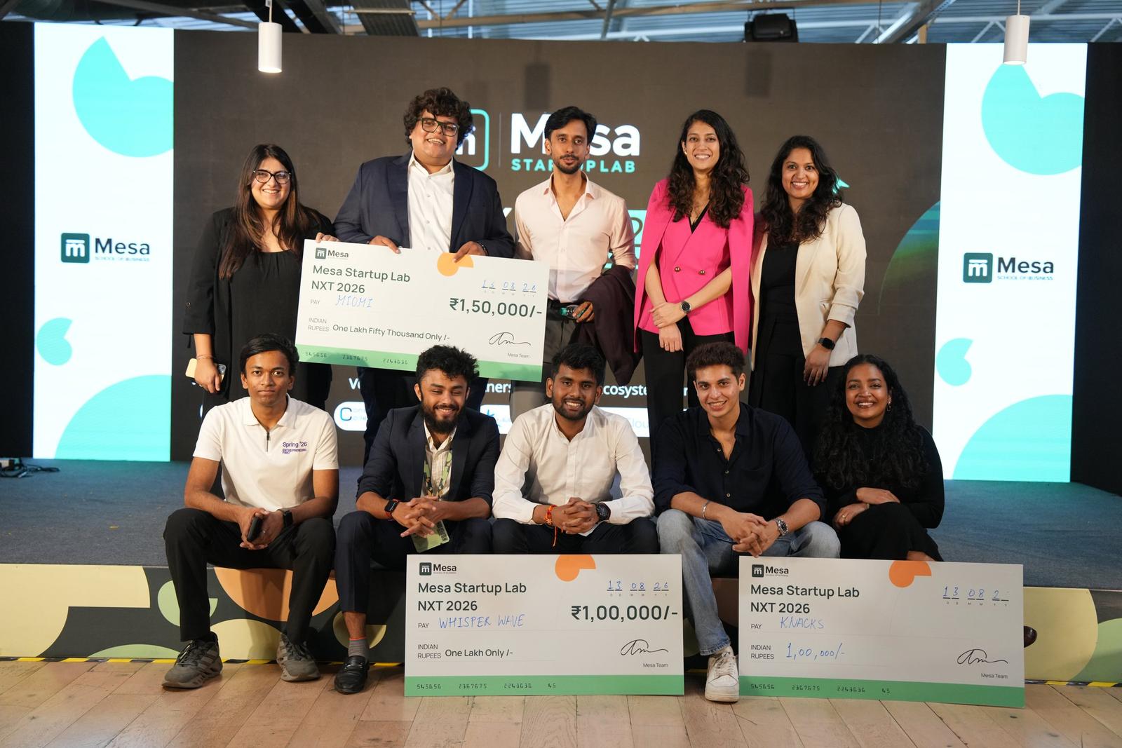 Founders and judges on stage at Mesa Startup Lab NXT 2026, holding prize cheques