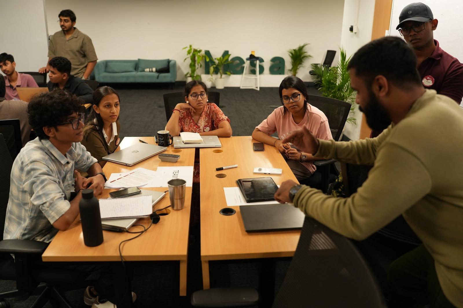 A mentor talking a founding team through their plan