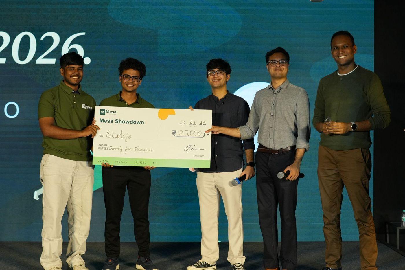 Studojo’s founders on stage with their Mesa Showdown cheque