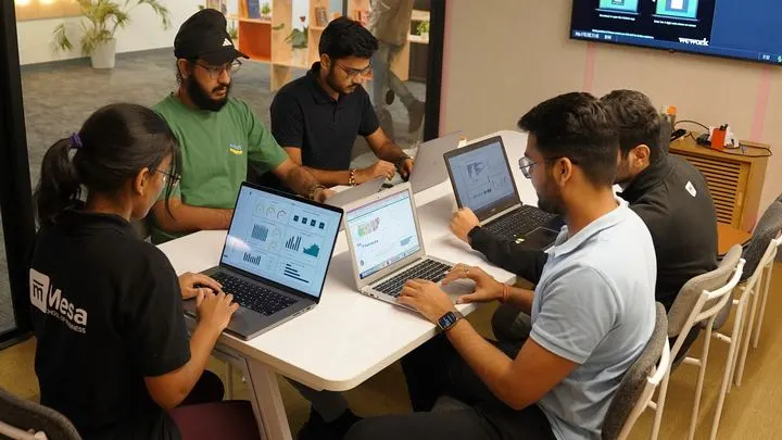 Students running AI workflows and dashboards on their laptops