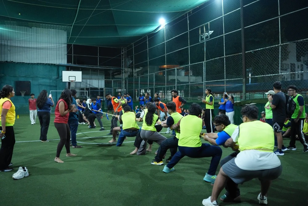 Two teams in a tug of war on the turf