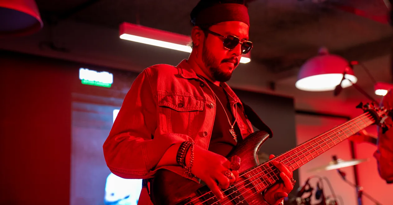 A guitarist performing at Maverion