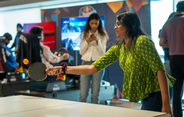 A student playing table tennis at Maverion